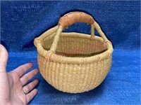 Smaller hand woven basket w/ leather handle