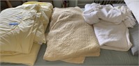 LARGE LOT OF BEDDING, COVERLETS ETC.