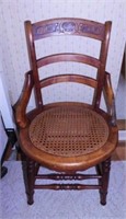 Antique carved walnut dining chair w/ hip rests &