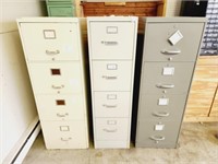 Group of three heavy duty file cabinets.