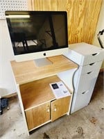 Office cabinets and apple computer monitor.