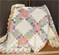 White, pink, and green quilt
