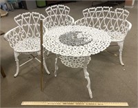 White cast iron table and chairs