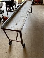 Long narrow table with wheels