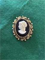 Cameo broach, set in an amber glass stone and
