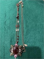 Long Chicos necklace with red and green stones,