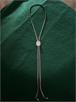 Gold bolo with mother of pearl center pull