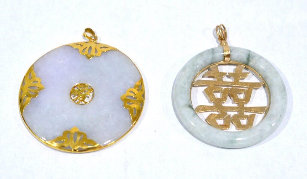 Two Gold Mounted Circular Jadeite Pendants