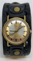 Vintage Timex electric watch, on broad leather ban