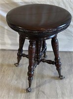 Antique clawfoot piano stool with marble claw