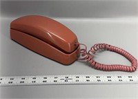 Vintage mauve colored wall phone