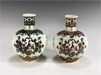 TWO SMALL CONTINENTAL FLORAL PEACOCK VASES