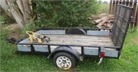 Single axle trailer with drop down ramp