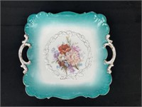 Handled hand painted dish, roughly 11 inches wide,