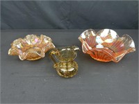 Two fluted, carnival glass bowls. The largest