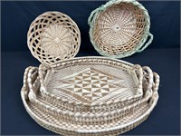 Three graduated wicker trays with two other