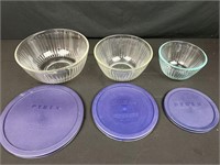 Three bowl graduated Pyrex with lids