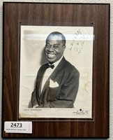 A signed picture by Louis Armstrong
