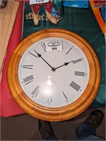 Wood trimmed wall clock