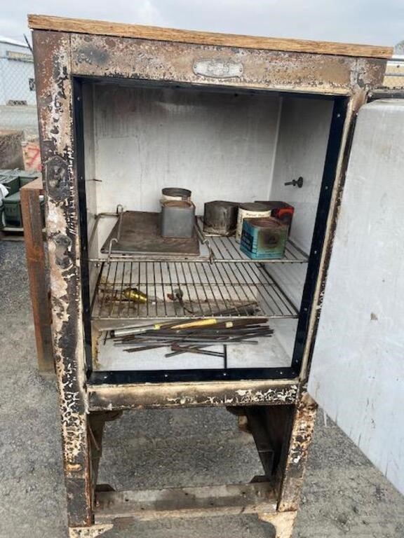 Steel Frigedaire for welding rods with light,