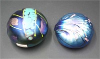 Two Colin Heaney iridescent art glass paperweights
