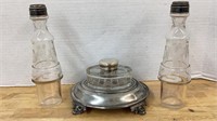 Single ink bottle in footed silver stand and two
