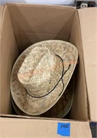 Box full of straw cowboy hats