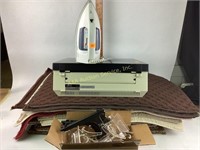 Brother typewriter, carpet samples, plate stands,