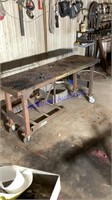 Metal table on rollers, 32” tall, 66”, 20” wide