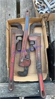 Three pipe wrenches