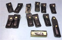 White farm knife and 12 knife cases