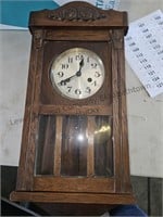 Vintage clock with pendulum and key