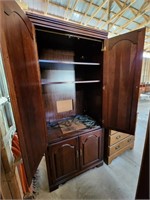 Dark wood entertainment center/armoire