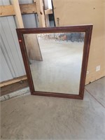 Wall mirror with wooden frame
