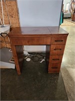 Sewing machine cabinet for electric sewing