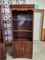 Bookcase with (2) shelves and storage doors