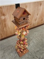 Decorative bird house on a stand