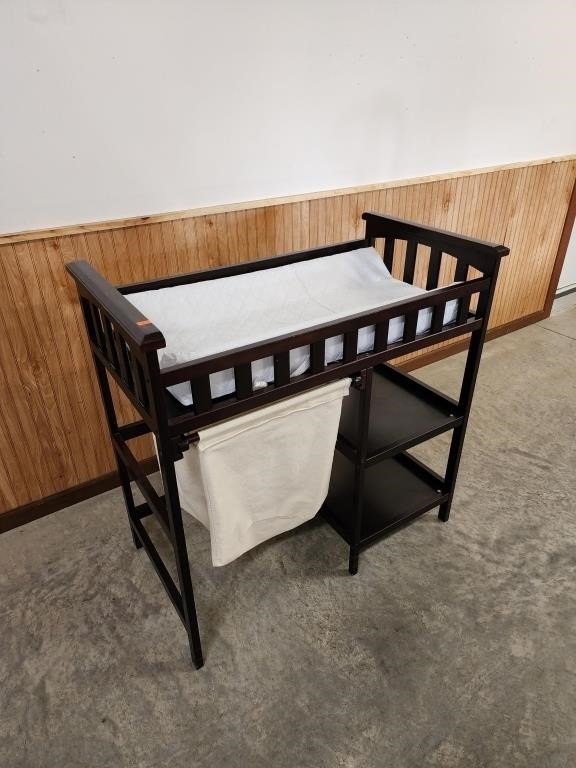 Changing table with hamper bag and shelves