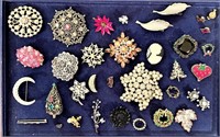 Costume jewelry brooches and pins