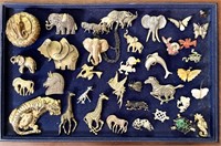 Large group of animal brooches