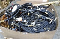 Tote of hydraulic hoses, over full