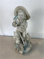 Boy fishing statue. Approximately 18 inches tall.