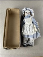 Vintage porcelain doll with box. Approximately 16