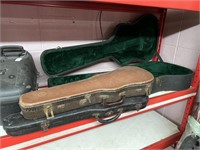 Guitar case, and two violin cases