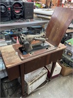 Electric sewing machine in cabinet