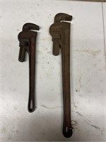 Two pipe wrenches, one medium one large