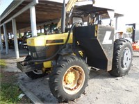 1999 Ford New Holland Tractor with attachment