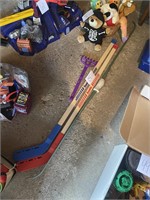 child's Franklin hockey sticks and bow
