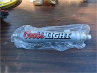 Coors Light beer tap handle.
