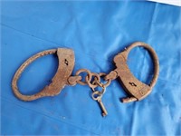 Hand Cuffs, with key, rusted shut